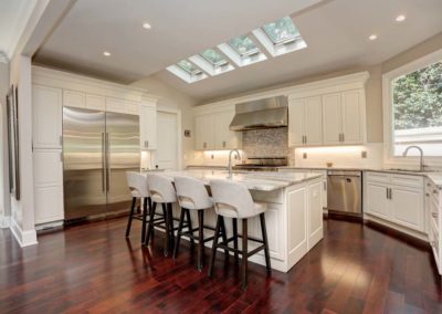 Large open kitchen with skylights. Marble-topped island large enough for 4 stools.