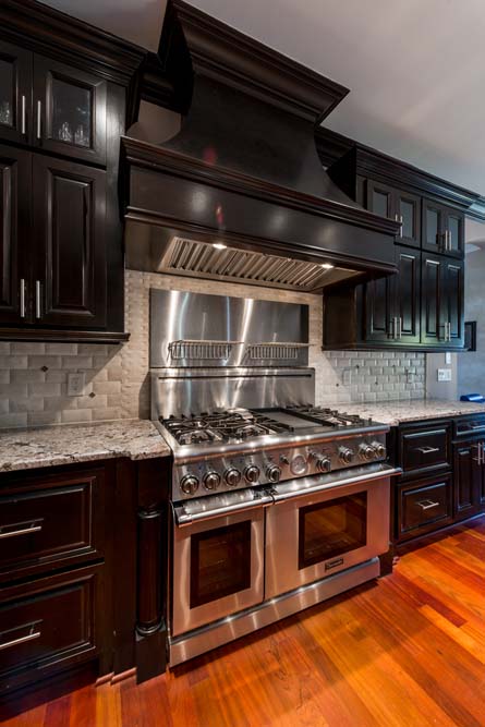 High-end oven and stove in kitchen.