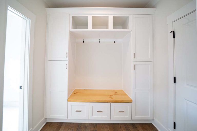 Built-in cabinets with bench, coat hooks, drawers and cubby holes